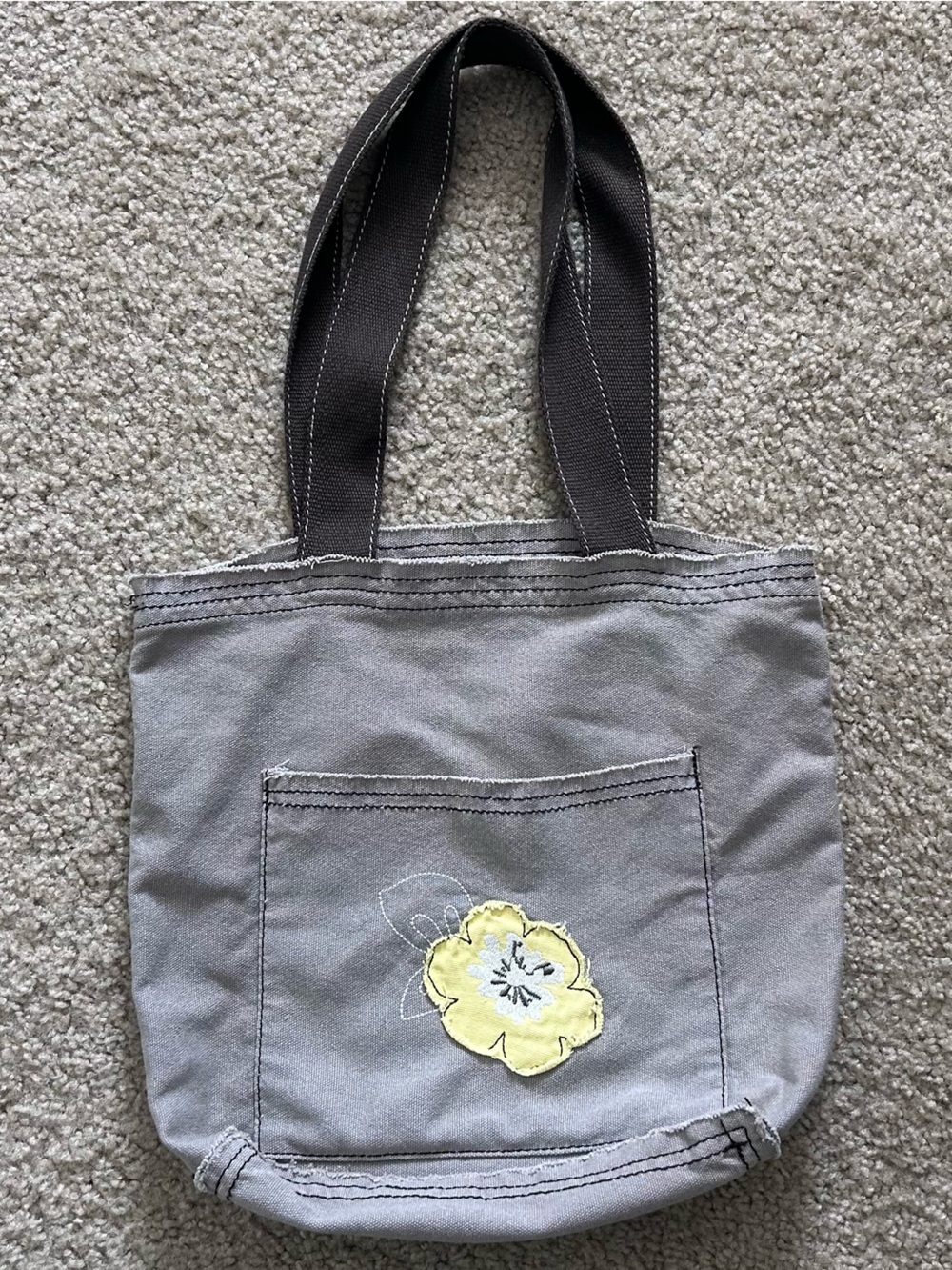 Thirty-One tote bag with front pocket and floral design in good condition